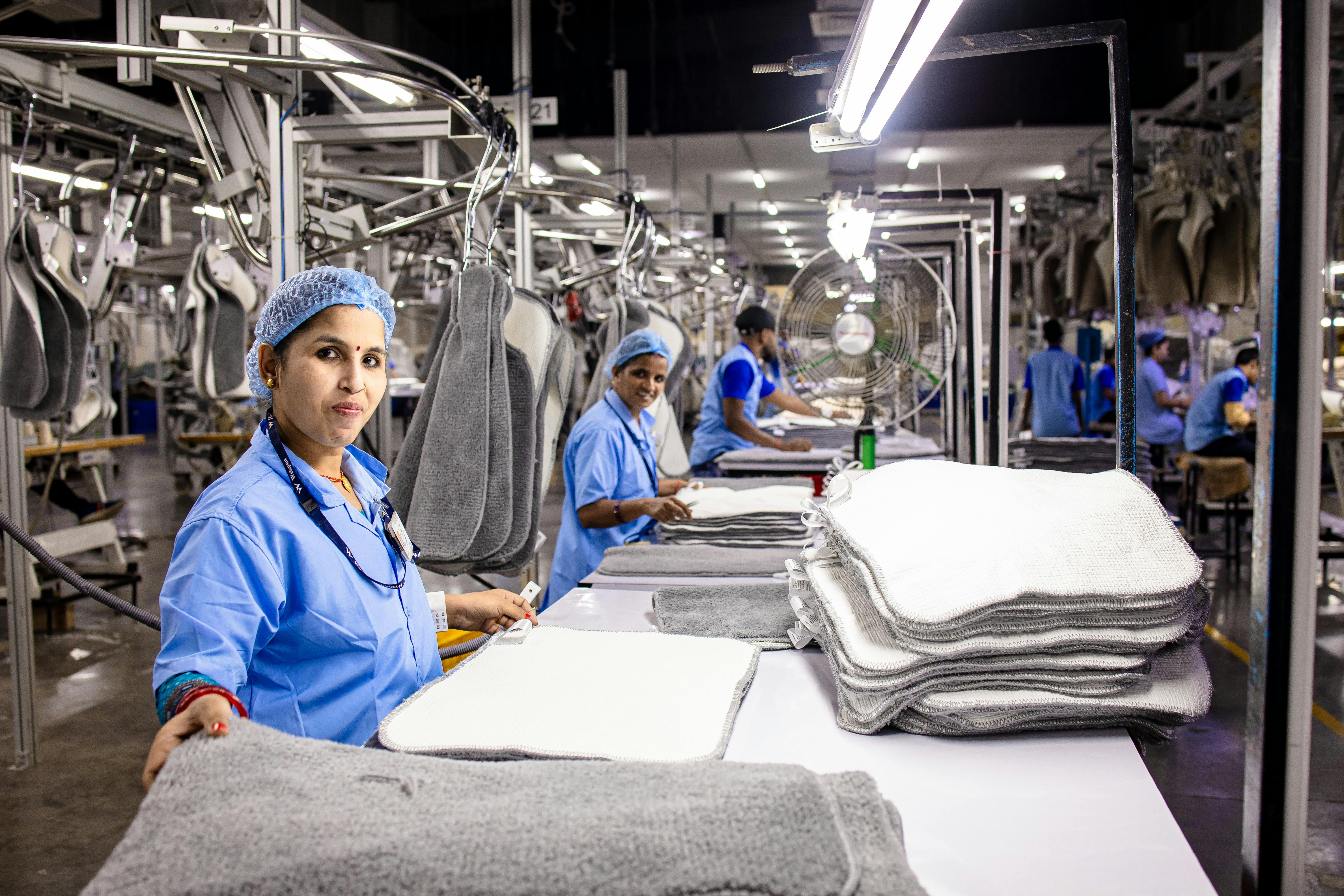Factory workers in production area
